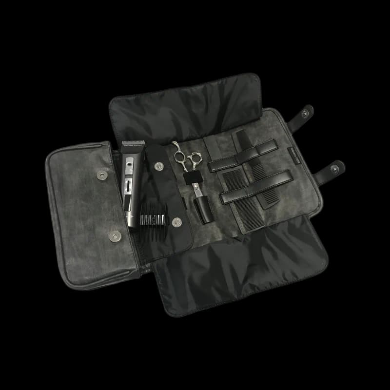 Magnetic barber-tool roll with washable inner mat and labelled pockets